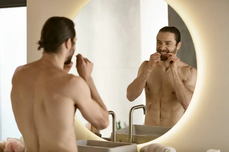stock-photo-man-brushing-teeth-front-mirror-part-morning-skincare-routine